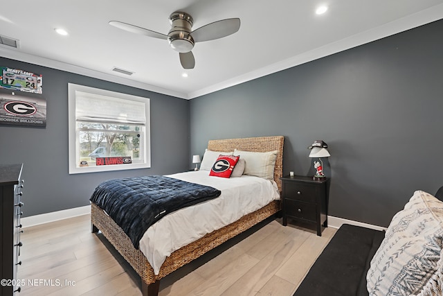 bedroom with light wood-type flooring, visible vents, ceiling fan, and baseboards