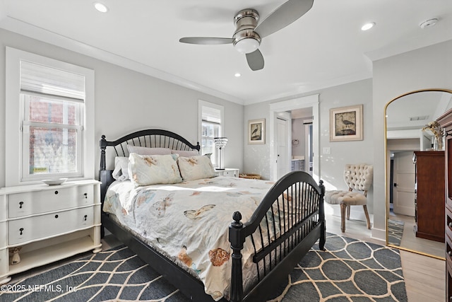 bedroom featuring ceiling fan, recessed lighting, wood finished floors, and crown molding