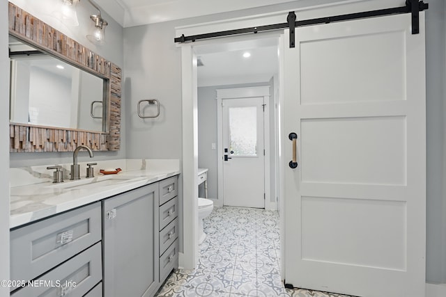 bathroom featuring toilet and vanity