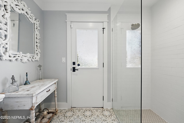 interior space with light tile patterned floors and baseboards