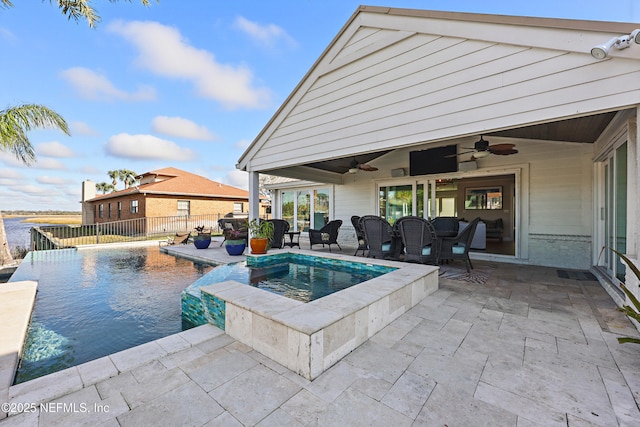 view of pool with ceiling fan, a patio, fence, and a fenced in pool