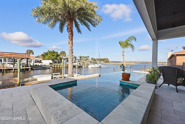 view of swimming pool with a water view