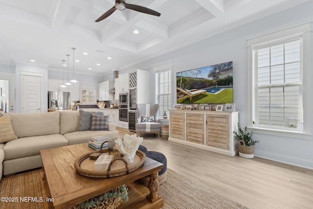 living room with light wood finished floors, coffered ceiling, ornamental molding, beam ceiling, and recessed lighting