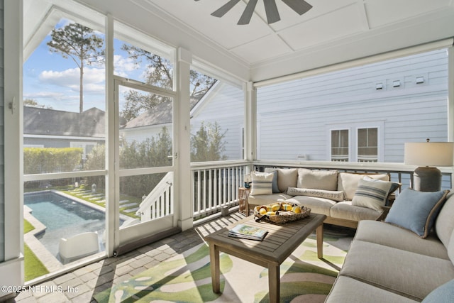 sunroom with ceiling fan