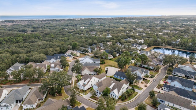 birds eye view of property featuring a water view and a residential view