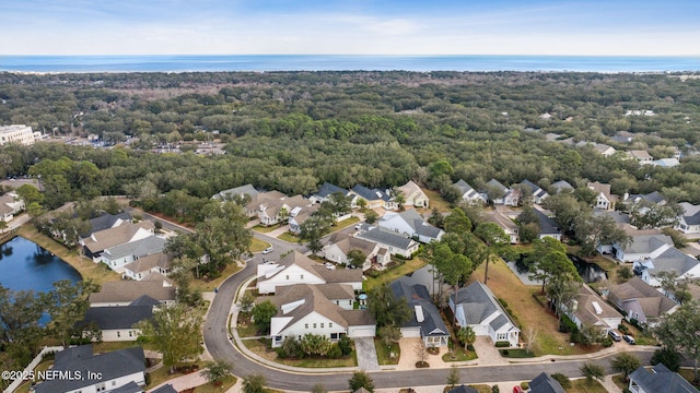 birds eye view of property with a residential view and a water view