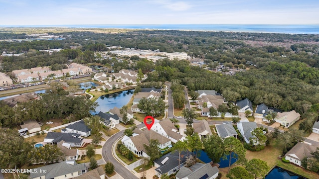 aerial view featuring a water view and a residential view