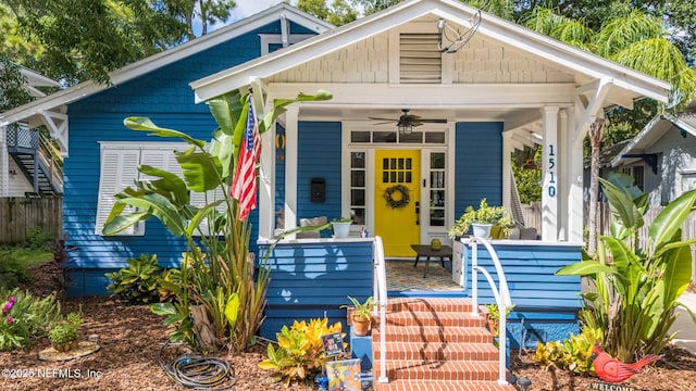 shotgun-style home with covered porch and ceiling fan