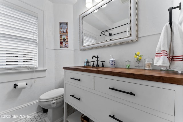 half bath with toilet and vanity