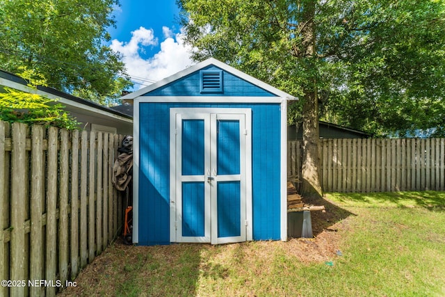 view of shed featuring a fenced backyard