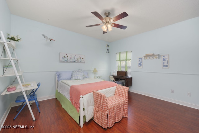 bedroom featuring a ceiling fan, baseboards, and wood finished floors