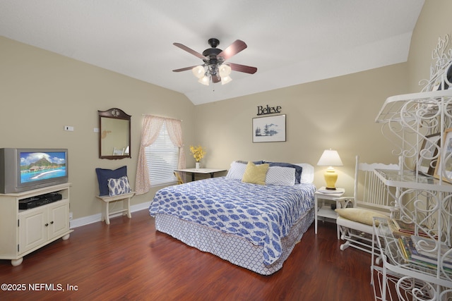 bedroom with ceiling fan, wood finished floors, baseboards, and vaulted ceiling