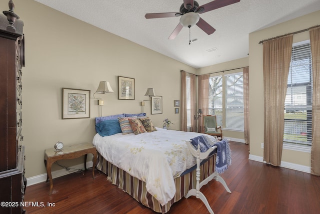 bedroom featuring a ceiling fan, access to outside, a textured ceiling, wood finished floors, and baseboards