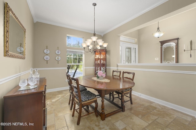 dining space with stone tile floors, a chandelier, baseboards, and ornamental molding