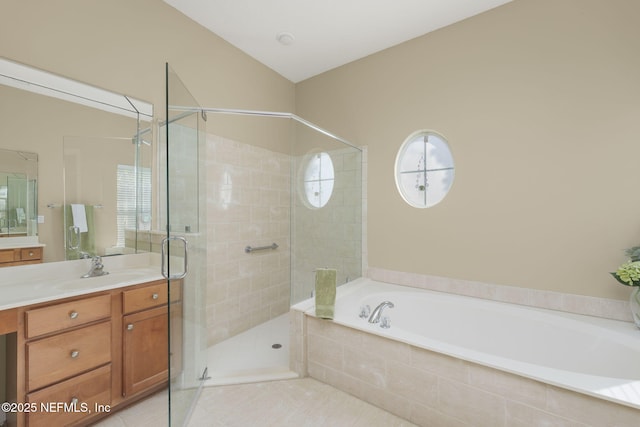 bathroom featuring vanity, a stall shower, vaulted ceiling, tile patterned floors, and a bath