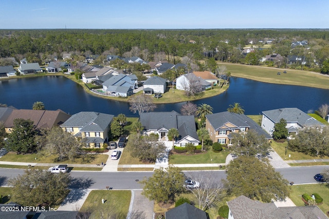 bird's eye view featuring a residential view and a water view