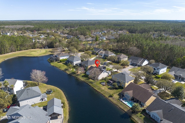 drone / aerial view featuring a residential view and a water view