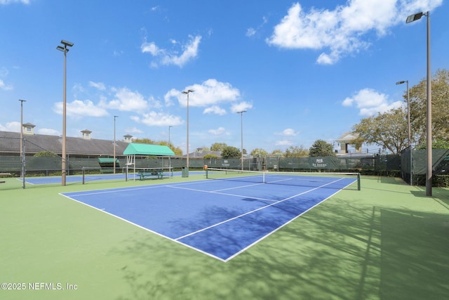 view of sport court with fence