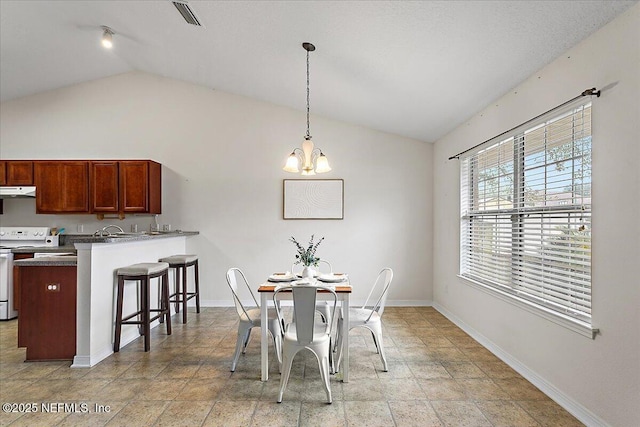 dining area featuring a chandelier, lofted ceiling, visible vents, and baseboards