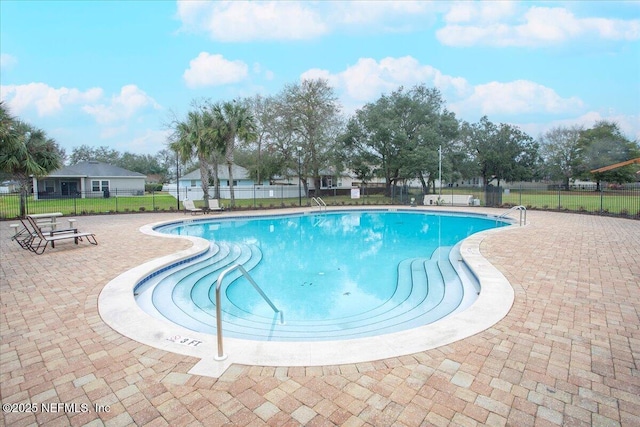 pool featuring a patio and fence