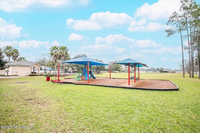 communal playground featuring a lawn