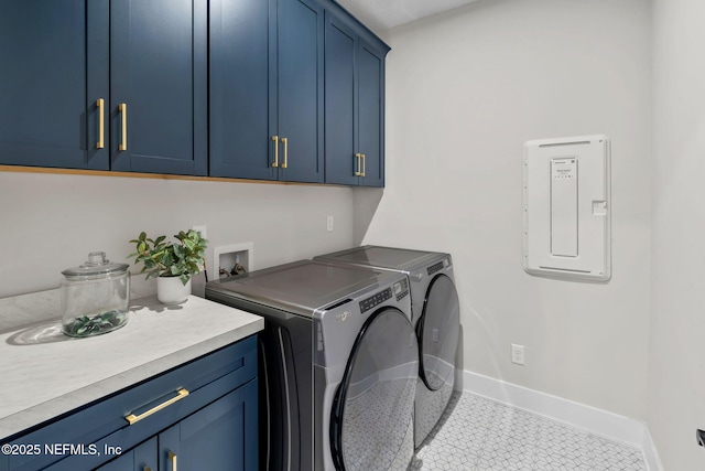 clothes washing area featuring tile patterned flooring, baseboards, independent washer and dryer, electric panel, and cabinet space