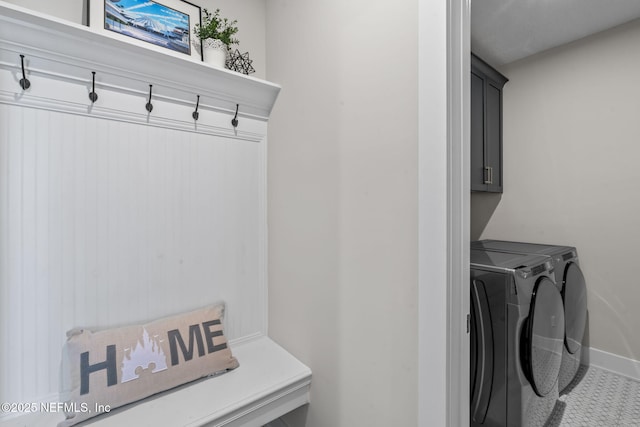 mudroom featuring washer and clothes dryer and baseboards