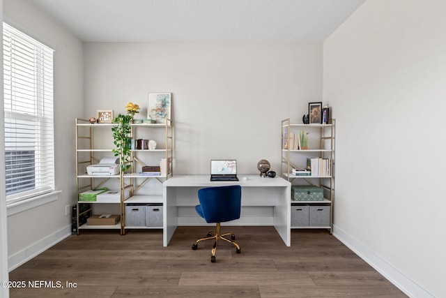 office area with wood finished floors and baseboards