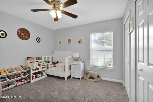 bedroom featuring a ceiling fan, carpet flooring, and baseboards