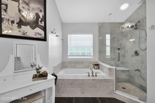 full bathroom with a garden tub and a shower stall