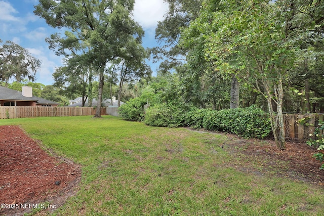 view of yard with fence