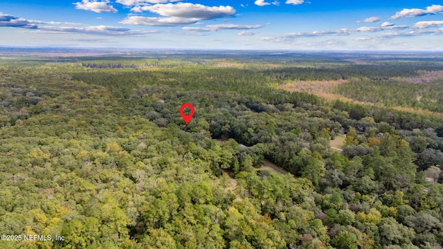 drone / aerial view with a view of trees