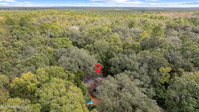 drone / aerial view with a forest view