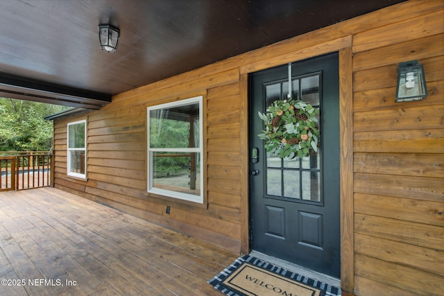 property entrance with covered porch