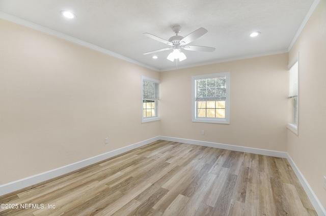 unfurnished room with ornamental molding, light wood finished floors, baseboards, and a ceiling fan