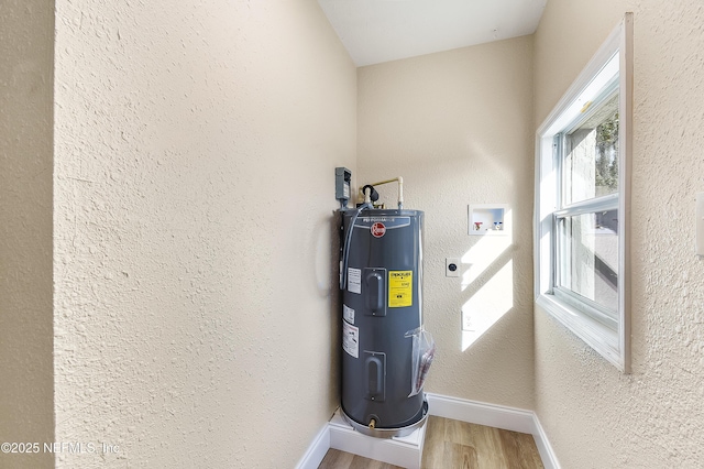 utility room with water heater