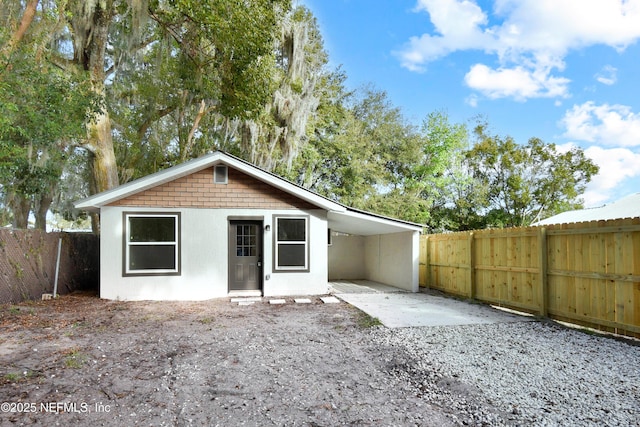 back of property with a patio area and a fenced backyard