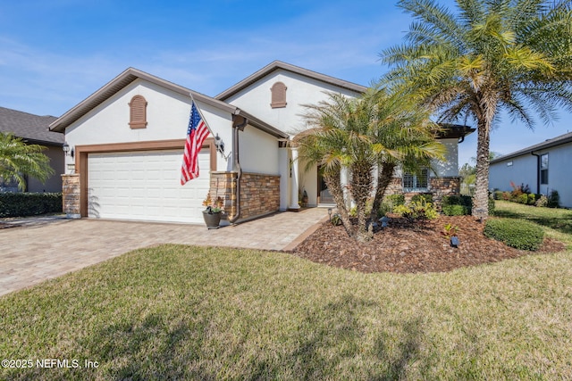 102 Bridge Oak Ln, Saint Augustine, FL 32095 - view of front of property with a garage, a front lawn, decorative driveway, and stucco siding