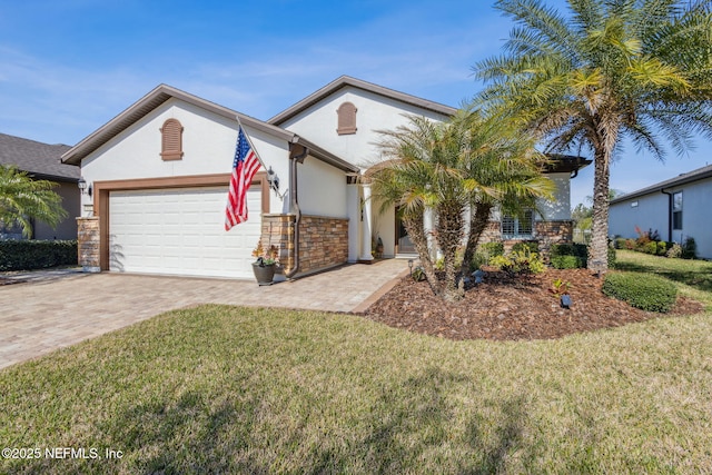 view of front of property with a garage, a front lawn, decorative driveway, and stucco siding