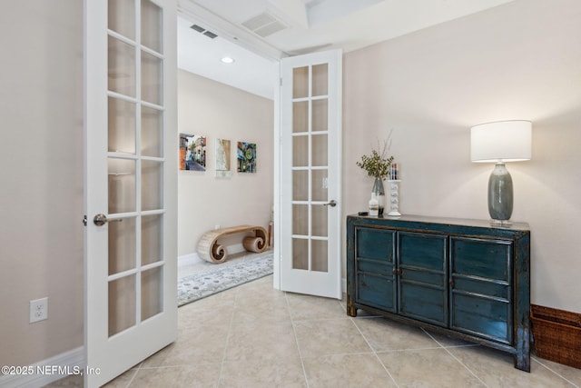 interior space featuring french doors, visible vents, and tile patterned floors