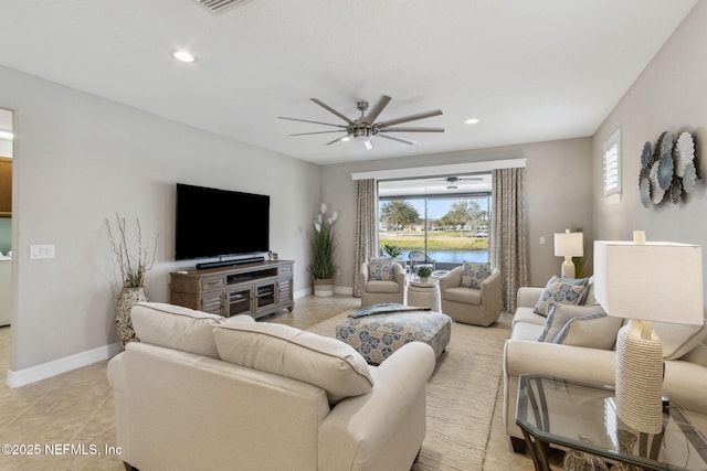 living room featuring ceiling fan, recessed lighting, light tile patterned flooring, and baseboards