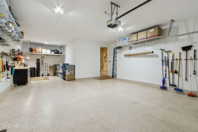 garage featuring baseboards and a garage door opener