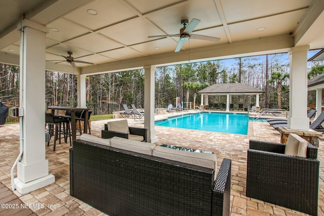 view of pool featuring an outdoor hangout area, outdoor dry bar, a patio area, and a fenced in pool