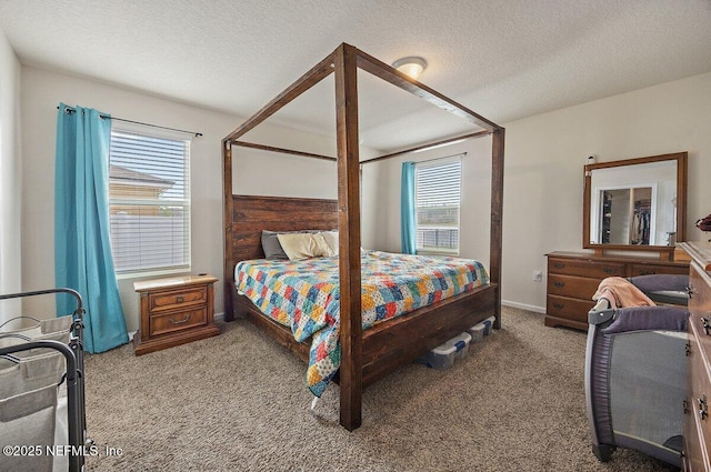 carpeted bedroom featuring a textured ceiling