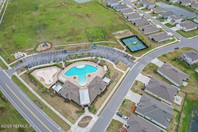 birds eye view of property with a residential view