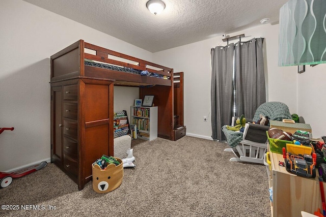 bedroom featuring a textured ceiling, carpet floors, and baseboards