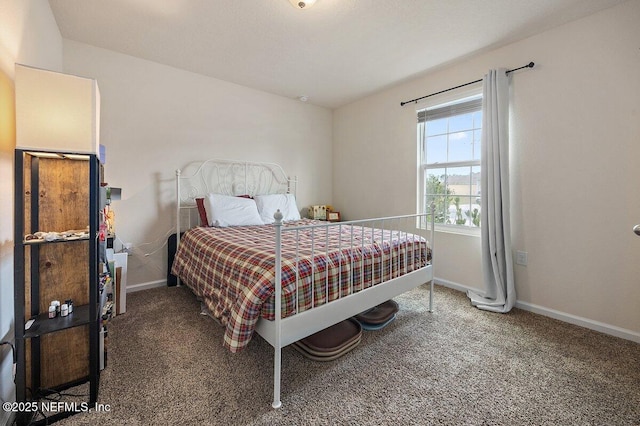 bedroom featuring carpet flooring and baseboards