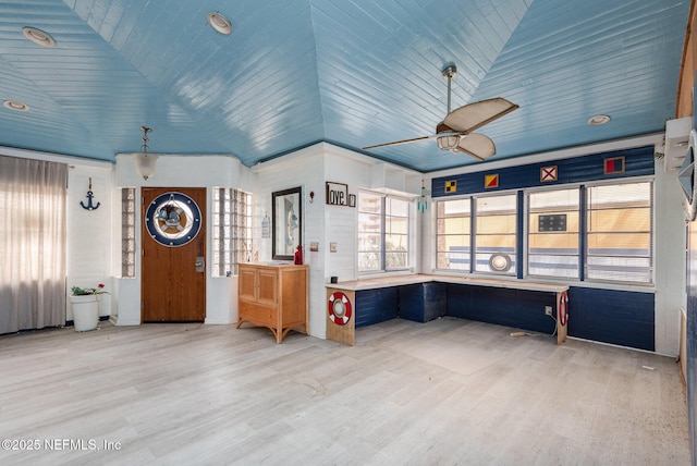 interior space with wooden ceiling, vaulted ceiling, and wood finished floors