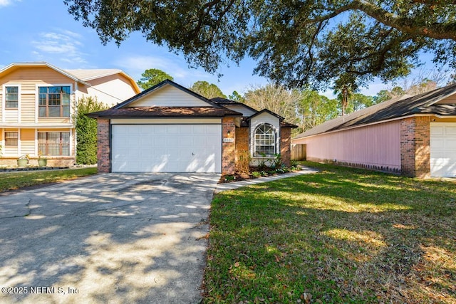 view of front of home with a garage, brick siding, driveway, and a front lawn