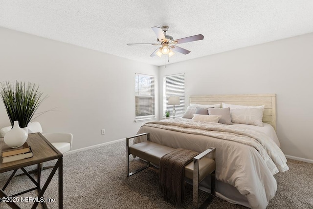 bedroom with carpet, baseboards, and a textured ceiling